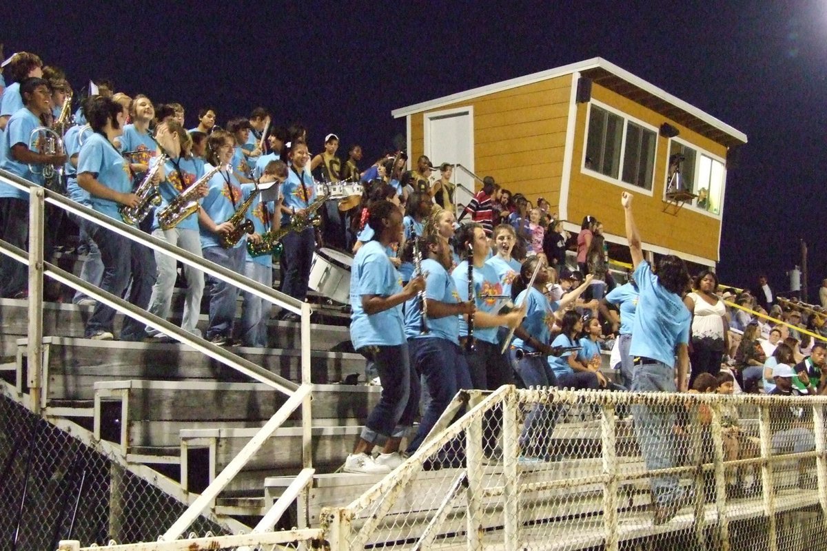 Image: Band plays with spirit — Drum Major, Chase Michaels, leads the band to a fun time.