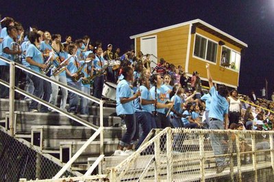Image: Band plays with spirit — Drum Major, Chase Michaels, leads the band to a fun time.