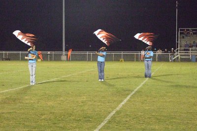 Image: Flags of fire — The Flag Corps  performs with the band at every halftime.