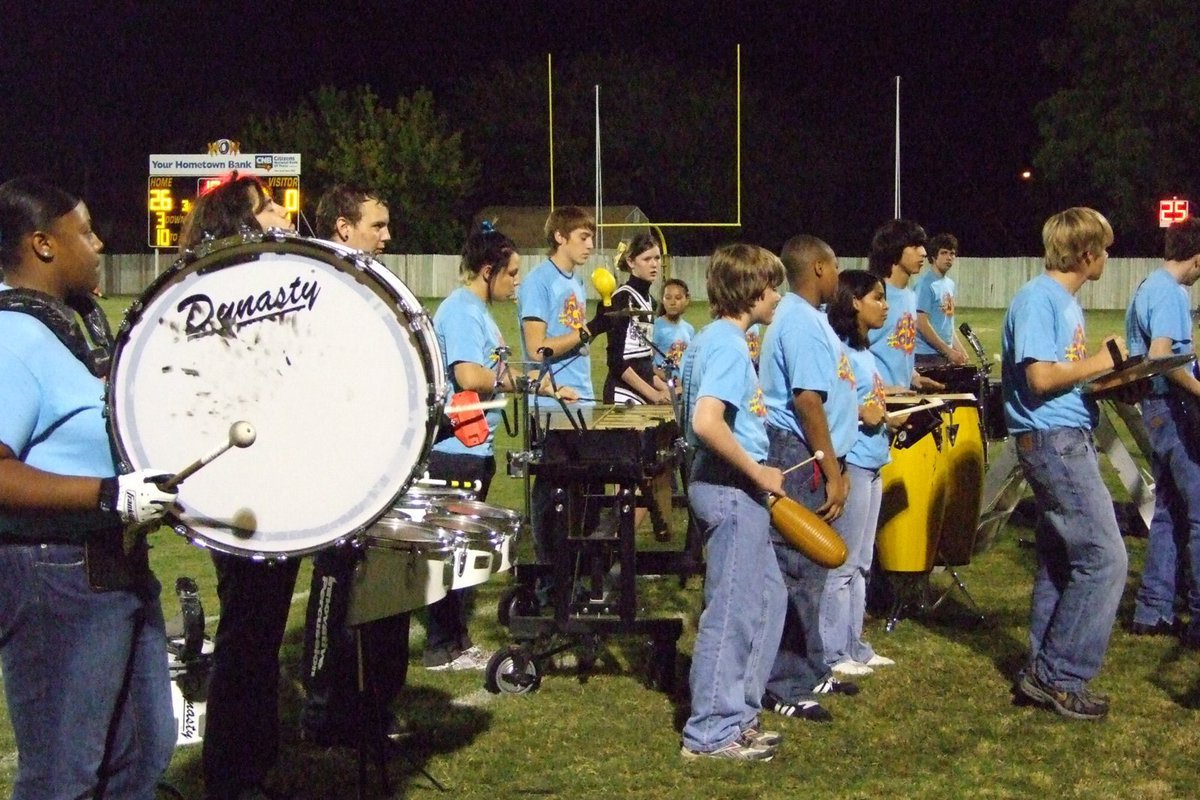 Image: Percussion section — The Italy band is having a lot of fun at the games.