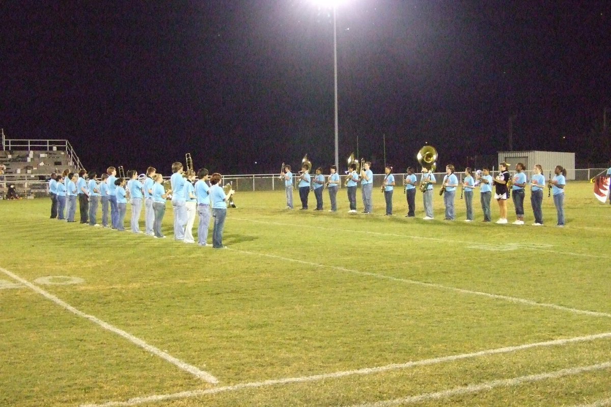 Image: Face to face — The Italy Band marches at halftime.