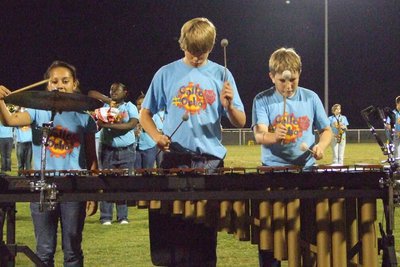 Image: Percussion team work — The band performs “Oye Como Va” and “St. Thomas” at halftime.