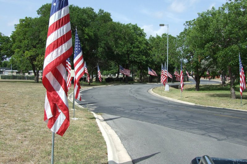 Image: American Flags — American flags line the drive to the Veteran’s Hospital in Kerrville, Texas.  A sight to behold.