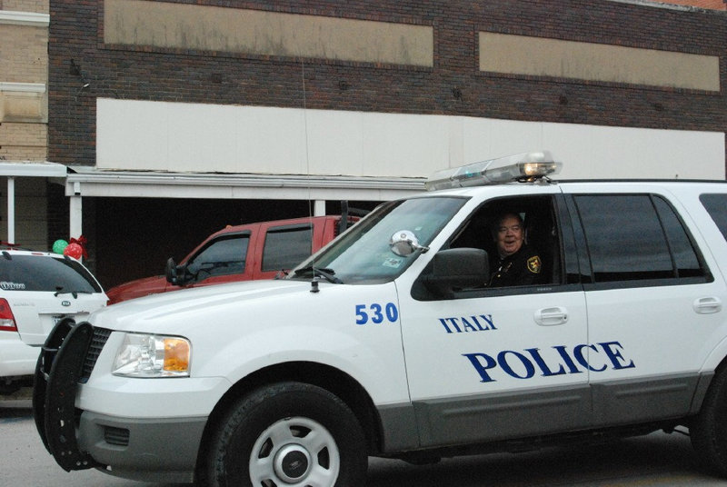 Image: Italy Police Float — The Italy Police Department participates in the Christmas parade.