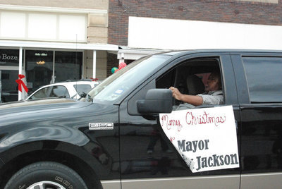 Image: The Mayor Loves Parades — The Mayor is beaming with pride as he enjoys participating in the downtown parade.
