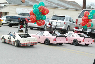 Image: Do Not Adjust Your Monitor — The Haight Family’s mini cars are a ballooned up and ready to cruise into christmas.