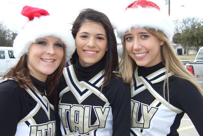 Image: Three Cheers For Christmas — Italy Cheerleaders pose in their Santa caps during the parade and festival.
