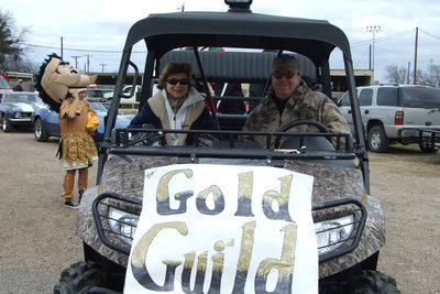 Image: Gold Guild Cranks It Up — Gold Guild cranks up the Gladiator Spirit during the Christmas Parade.