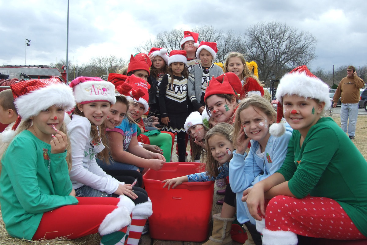 Image: Friends and candy canes — These young Santa helpers participated in Italy’s first annual Christmas Festival doing their part to spread Christmas cheer.