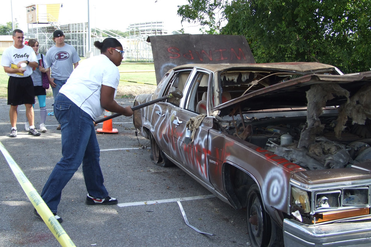 Image: Jasmine Wallace — Jasmine releases tension by hitting the poor car.