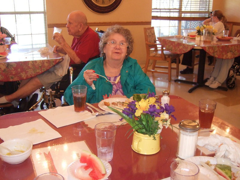 Image: The cafeteria at Trinity Mission was decked out with beautiful flower arrangements on each table. Residents were really enjoying their lunch.