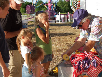 Image: The Elerson Family from Avalon tries their luck at the duck game during the IYAA Sports Carnival.
