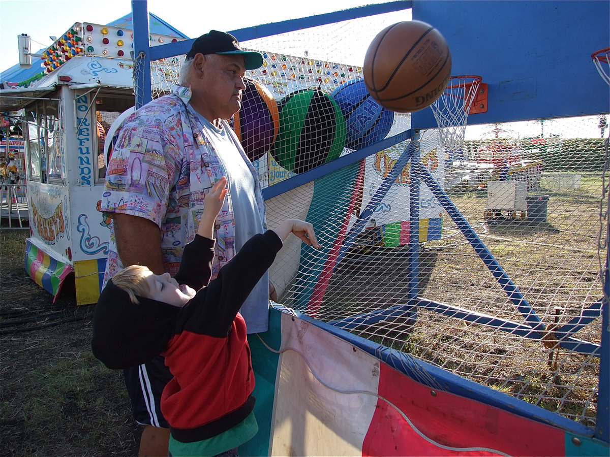 Image: Jon Hernandez takes his best shot at the basketball shoot. Nice form!