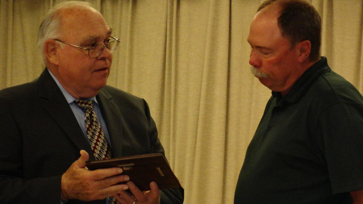 Image: Charles Williams presents plaque to Tommy Morrison.