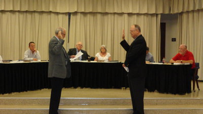 Image: Hunt County Judge Darrell Cockerham administers oath of office to Mark Stiles. 