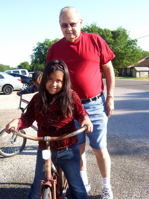 Image: Freddie Ivy and Anna Trejo. Anna said, “I feel good about getting this bike because my bike went to Mexico.”