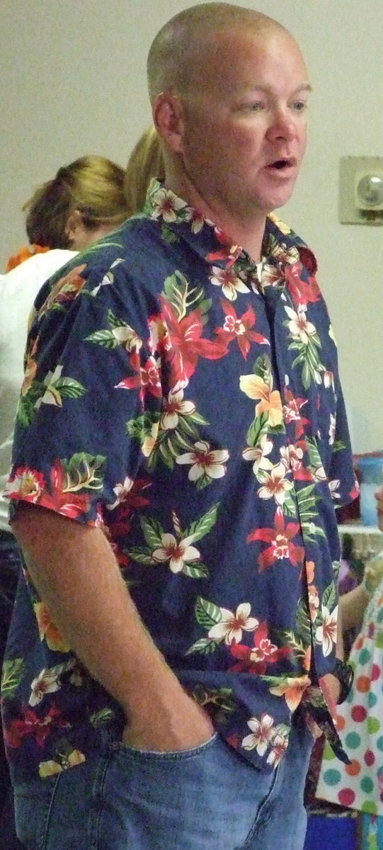 Image: Youth Pastor, Michael Chambers, welcomes the seniors to the luau.