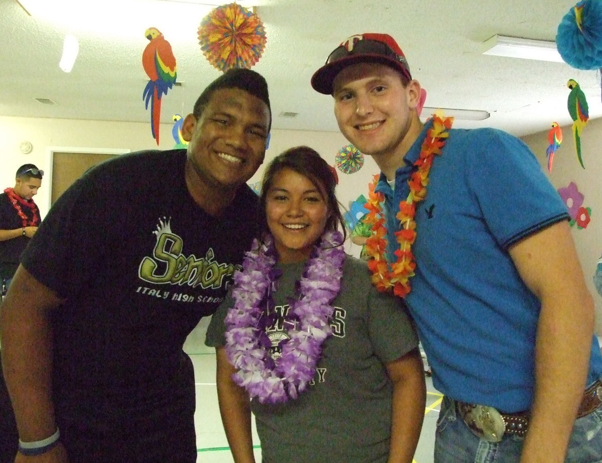 Image: The winners! DeAndre “Muscle Bob” Rettig, Marisella Perez and Kyle Wilkens share the Limbo trophy.