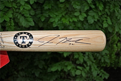Image: A close-up of Josh Hamilton’s signature on an authentic Texas Rangers baseball bat that is now being bidded on to raise monies for Relay for Life.
