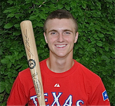 Image: Kolton Smith sports the Josh Hamilton autographed Texas Rangers baseball bat he is now accepting bids on for Relay for Life.