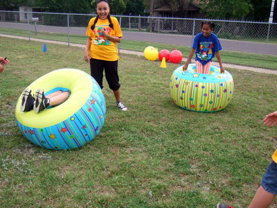 Image: Sumo wrestling was never so fun as at Stafford Elementary on field day. The idea is to get in the inner tube and try to knock your opponent over! I would say, “job well done, second graders.”