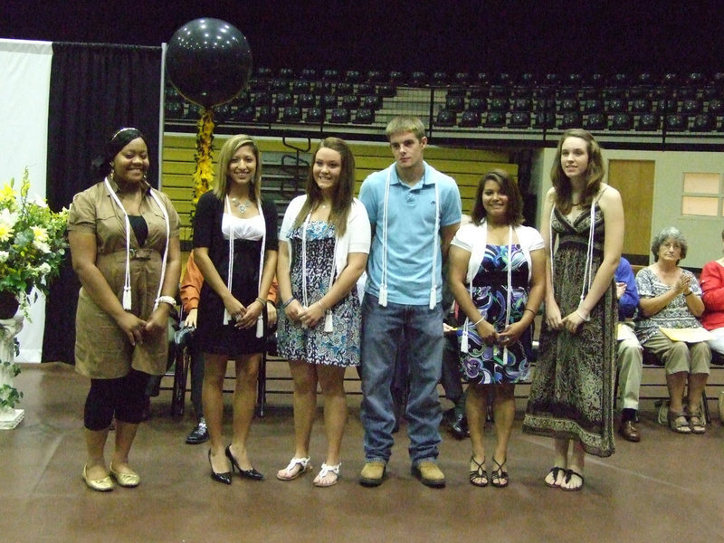 Image: Honored students receive their graduation chords.