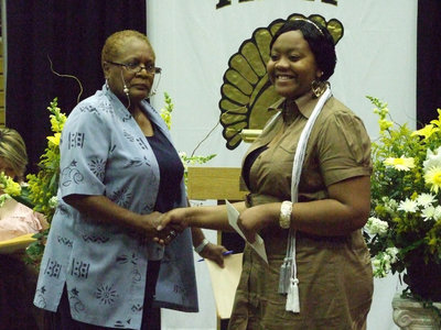 Image: Elmerine Bell presents Amber Mitchell the Stafford Alumni Scholarship, which began in 1963.
