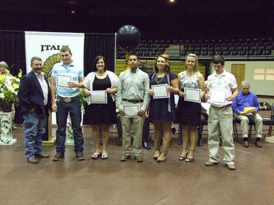 Image: Larry Eubank distributes the Italy Youth Buyers Fund to (L-R) Kyle Wilkins, Haley Pittmon, Michael Martinez, Molly Haight, Jacqualyn Cawley and Matt Brummett.