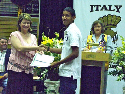 Image: Eddie Garcia receives one of the Lions Club scholarships from Ms. Parker and Flossie Gowin.
