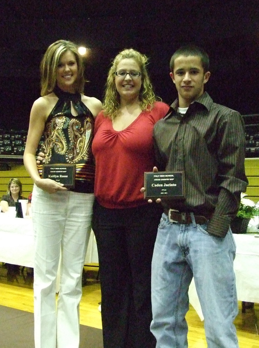 Image: Kaitlyn Rossa, Coach McDonald and Caden Jacinto smile for the camera after their presentation.