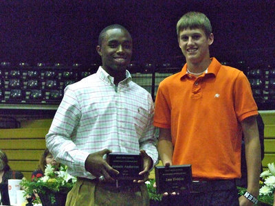 Image: Jase Holden receives Basketball Defensive MVP and Jasenio Anderson receives Basketball Offensive MVP.