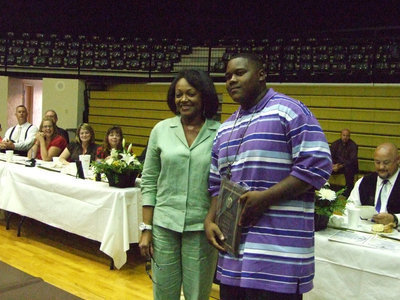 Image: Ms. Cherelle Riley awarded Bobby Wilson the David Henderson award.