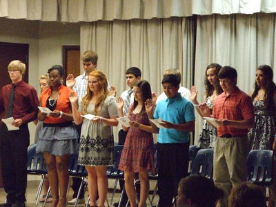 Image: The new NHS inductees take the pledge.