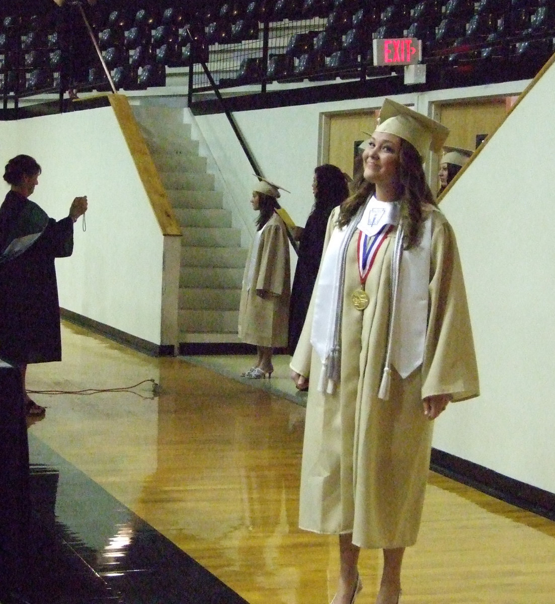 Image: Shelbi Gilley takes time for a smile as she is entering the dome on Friday night.