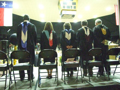 Image: Faculty, administration and guests wait for the graduates to be seated.