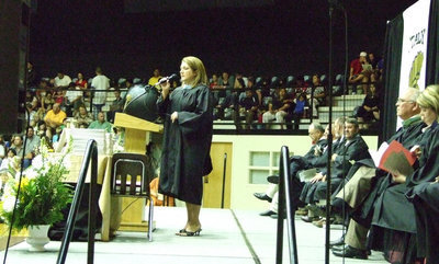 Image: Guest Clover Stiles sings to the graduates.