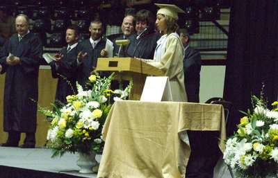 Image: Mrs. Bridge is awarded a plaque from the senior class.