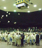 Image: Hats are off (and up) at the graduation ceremony held on Friday, May 27, 2011.