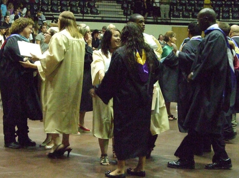 Image: The seniors take a last minute with teachers and friends.