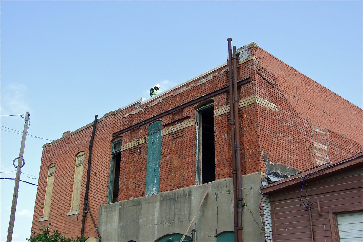 Image: Workers spend time on the roof as well.