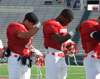 Image: Milford’s, Rolando Vega(4), and Italy’s, Jasenio Anderson(11), join their Fellowship of Christian Athletes Red Teammates during the pre-game prayer before the start of the 2011 Super Centex Heart of Texas FCA Victory Bowl played at Baylor’s Floyd Casey Stadium in Waco.