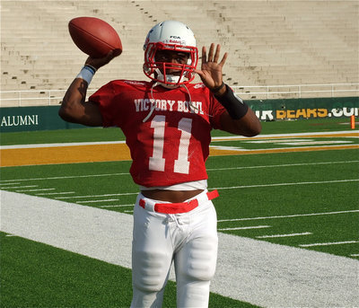Image: Jasenio Anderson(11) gets warmed up along the sideline before the kickoff.