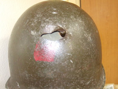 Image: The bullet exited out the back of Bell’s helmet.