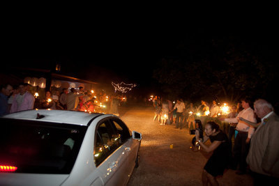 Image: The couple leave for Costa Rico with fanfare and sparklers.