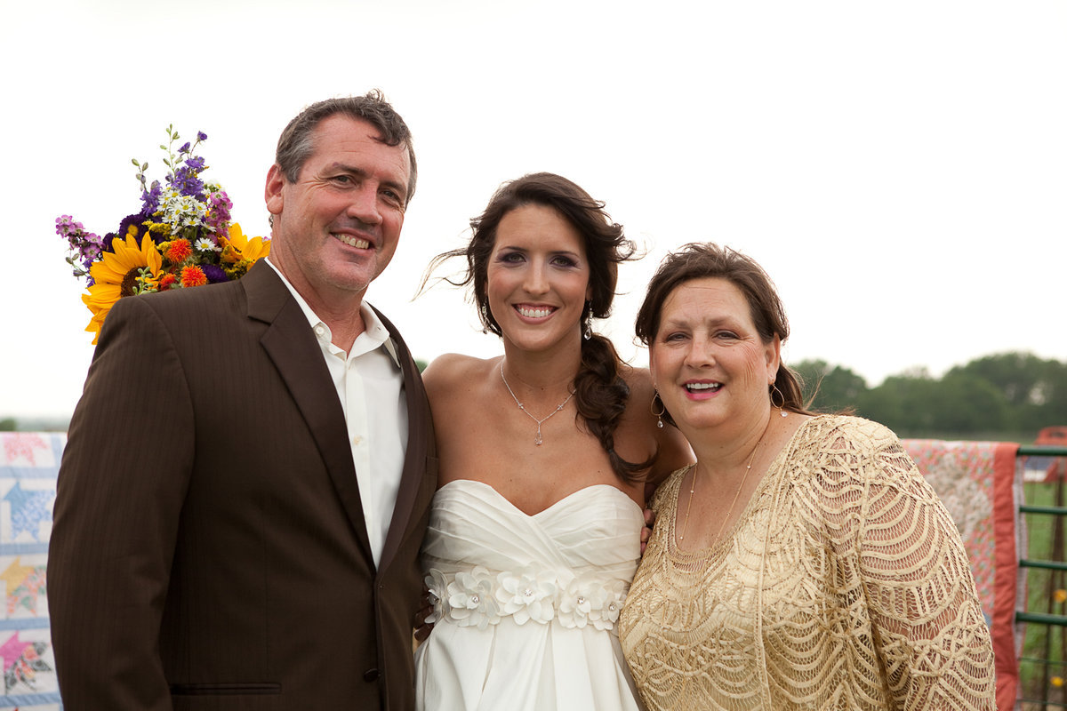 Image: Russ, Megann and Kelly Lewis smile for the camera.