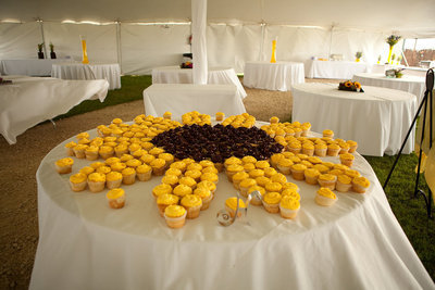 Image: The cupcakes were arranged in a sunflower to match the bride’s bouquet.