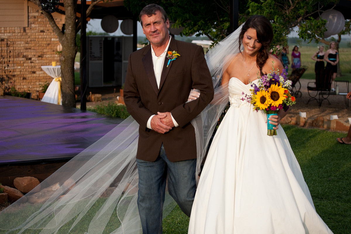 Image: Russ escorts the bride to the altar.