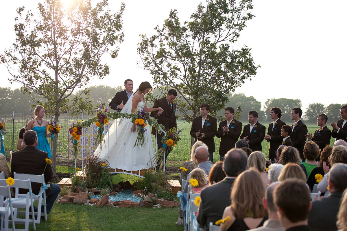 Image: Andrew escorts his bride down the aisle.