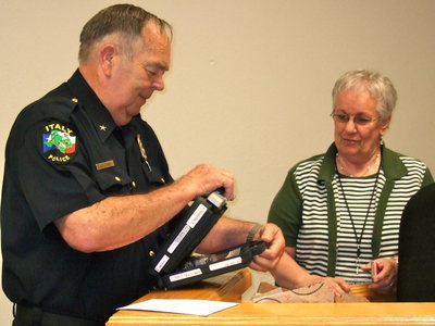 Image: Chief opening the gift with a smile.