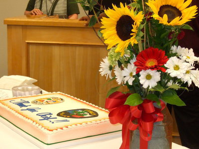 Image: Flowers and cake to honor the Chief.